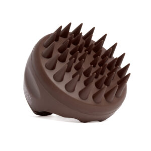 Szczotka Sister Young AURA Chocolate Coffee ułożona pod kątem, z wypustkami masującymi skierowanymi do góry.
